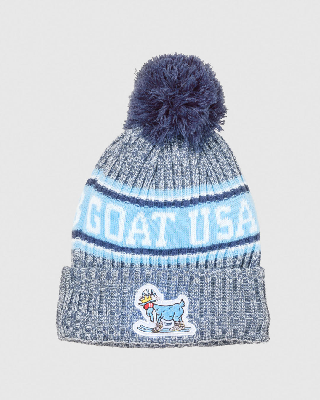 Winter hat with pom pom and skiing goat